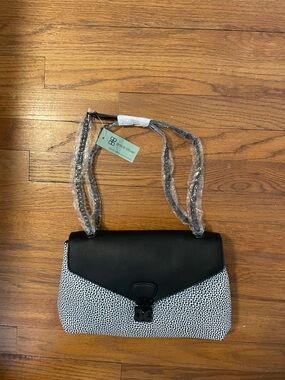 Brand new Christian Livingston handbag.